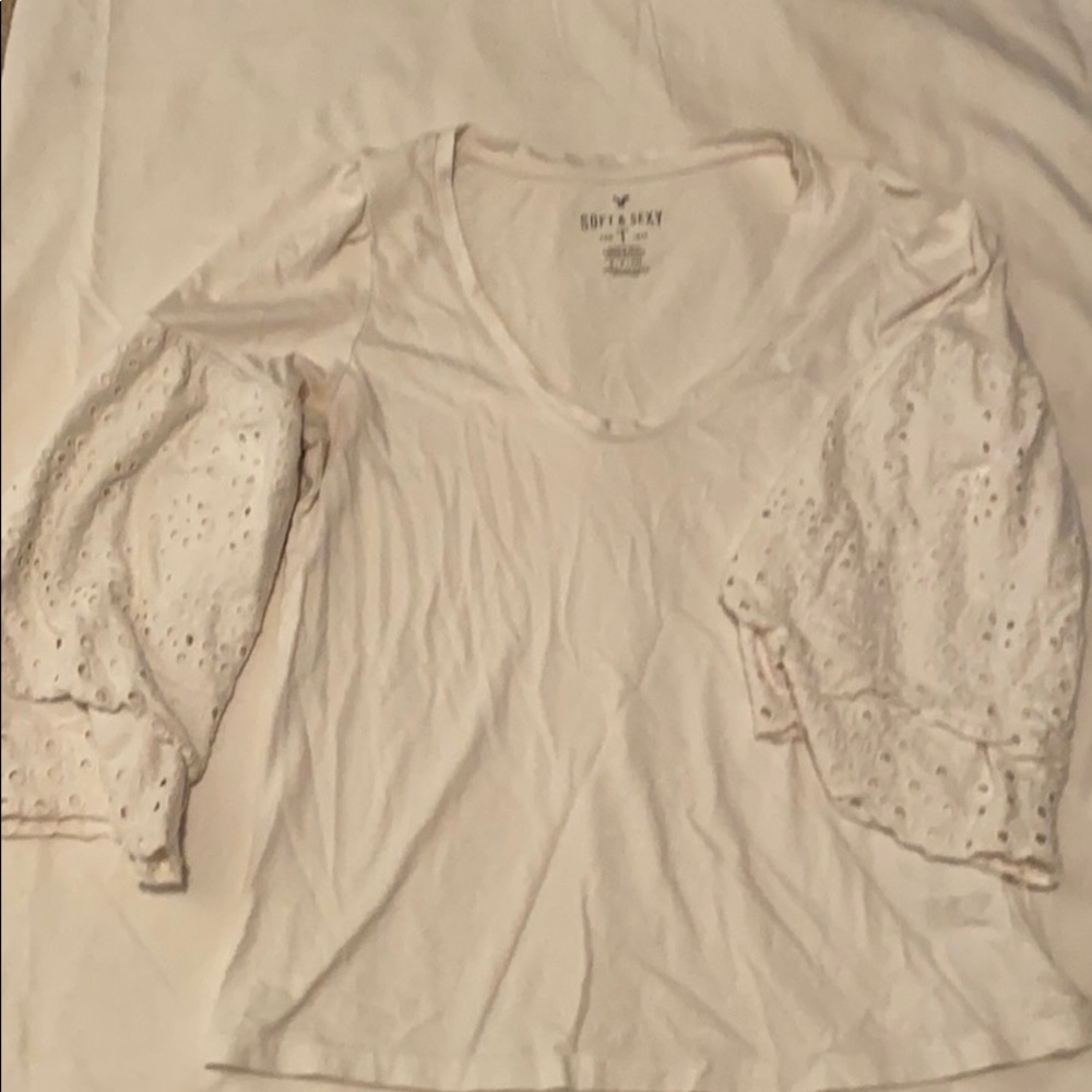 White top with elegant flowy eyelet sleeves